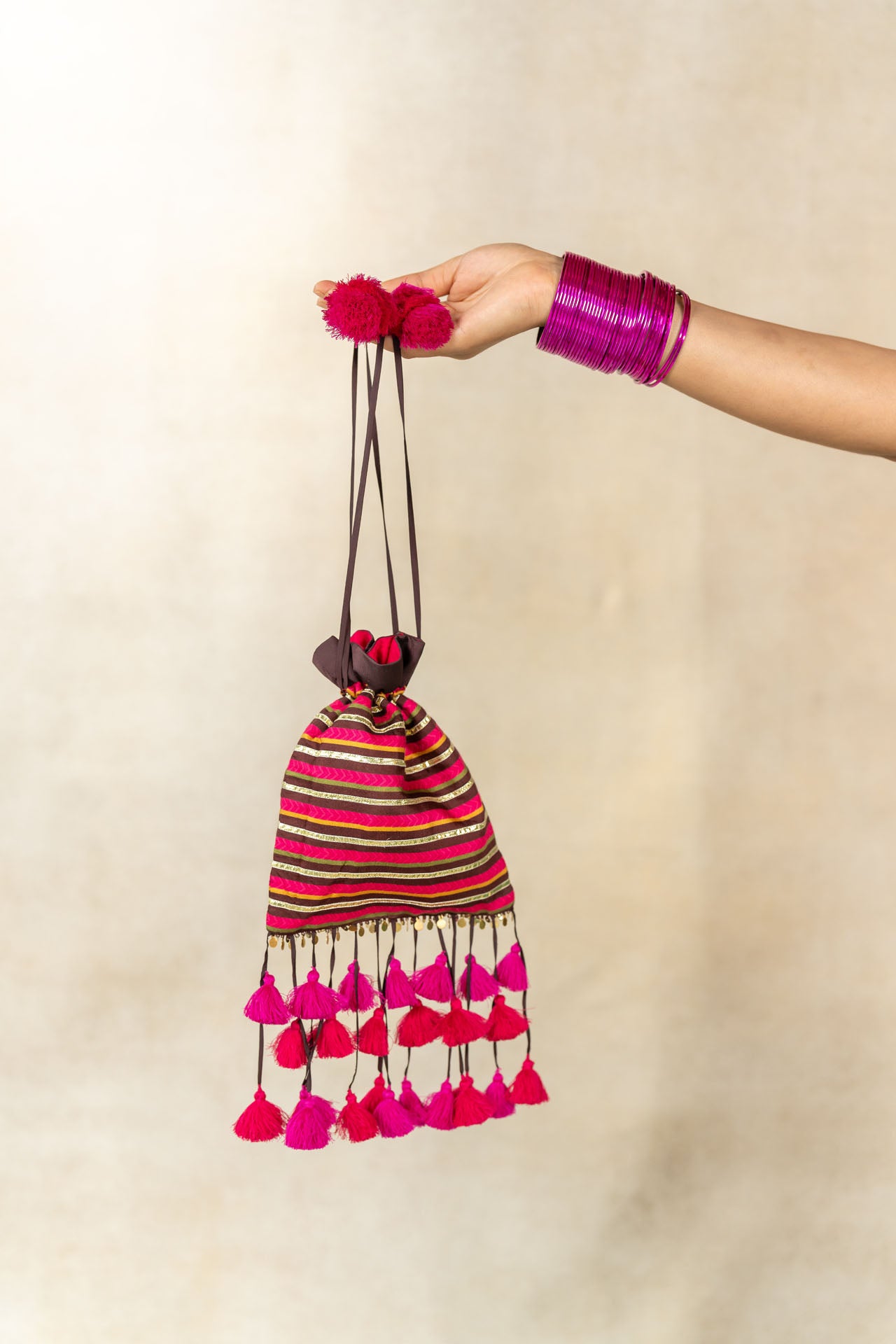 Brown-pink striped printed potli bag