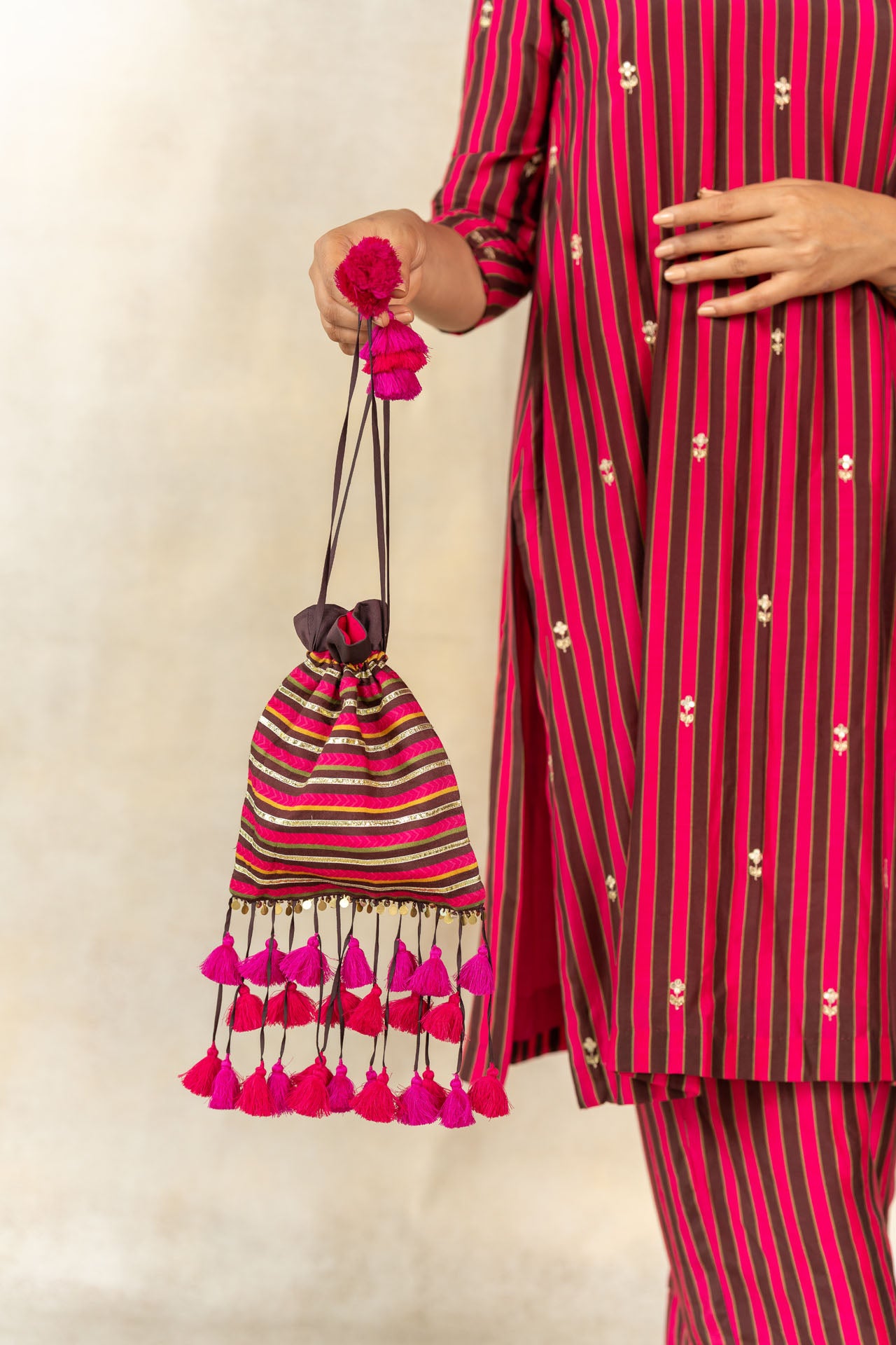 Brown-pink striped printed potli bag